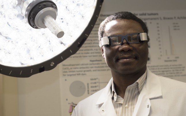 Samuel Achilefu, PhD, the Michel M. Ter-Pogossian Professor of Radiology, oversees a variety of cancer-fighting projects. They include development of goggles that help surgeons see and remove cancer and a therapy that uses a combination of light and a photosensitizing drug to kill malignant cells.